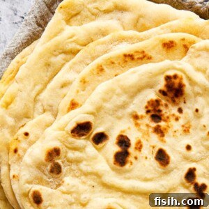 stacked flatbread on grey cloth napkin