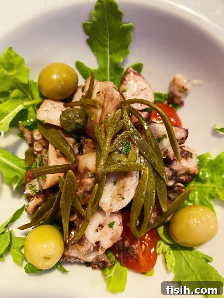 Salad with greens, olives and octopus
