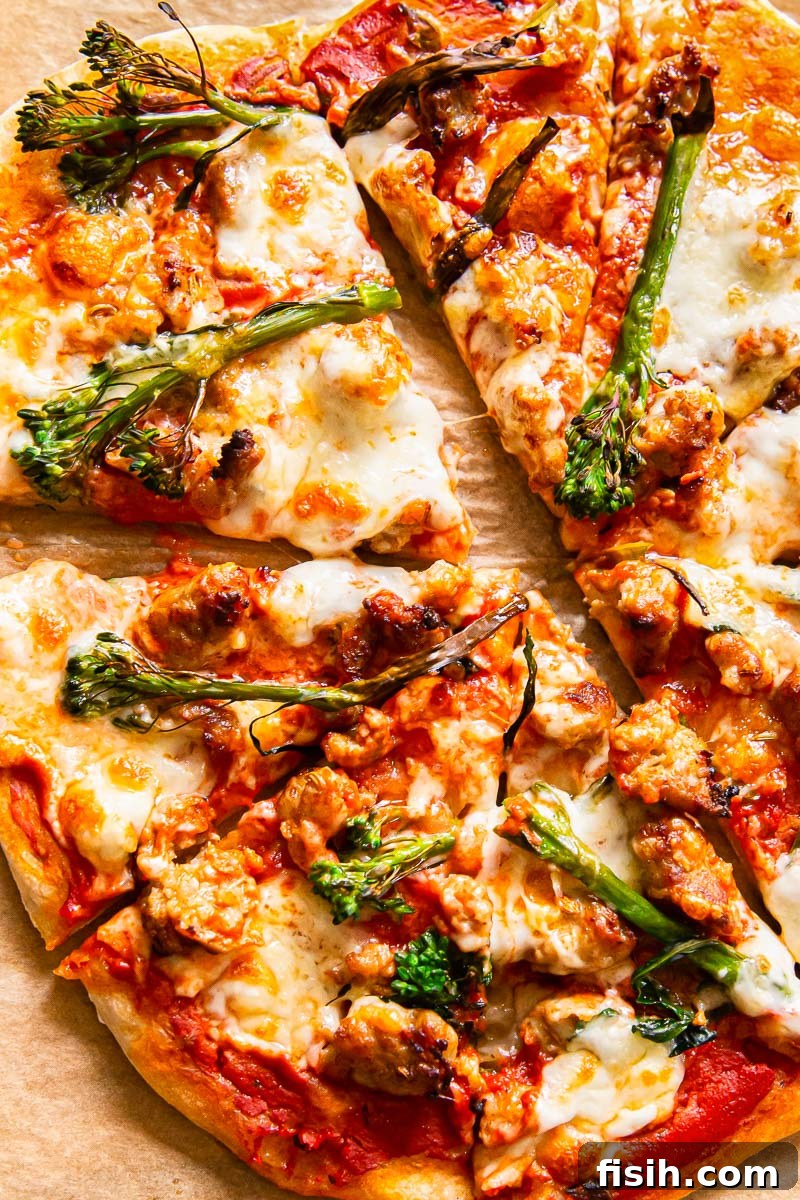 Sourdough Spicy Sausage and Broccoli Pizza, sliced and ready to serve