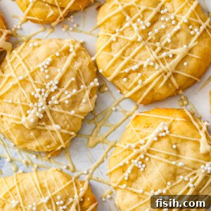 cookies with white chocolate drizzle and white sprinkles
