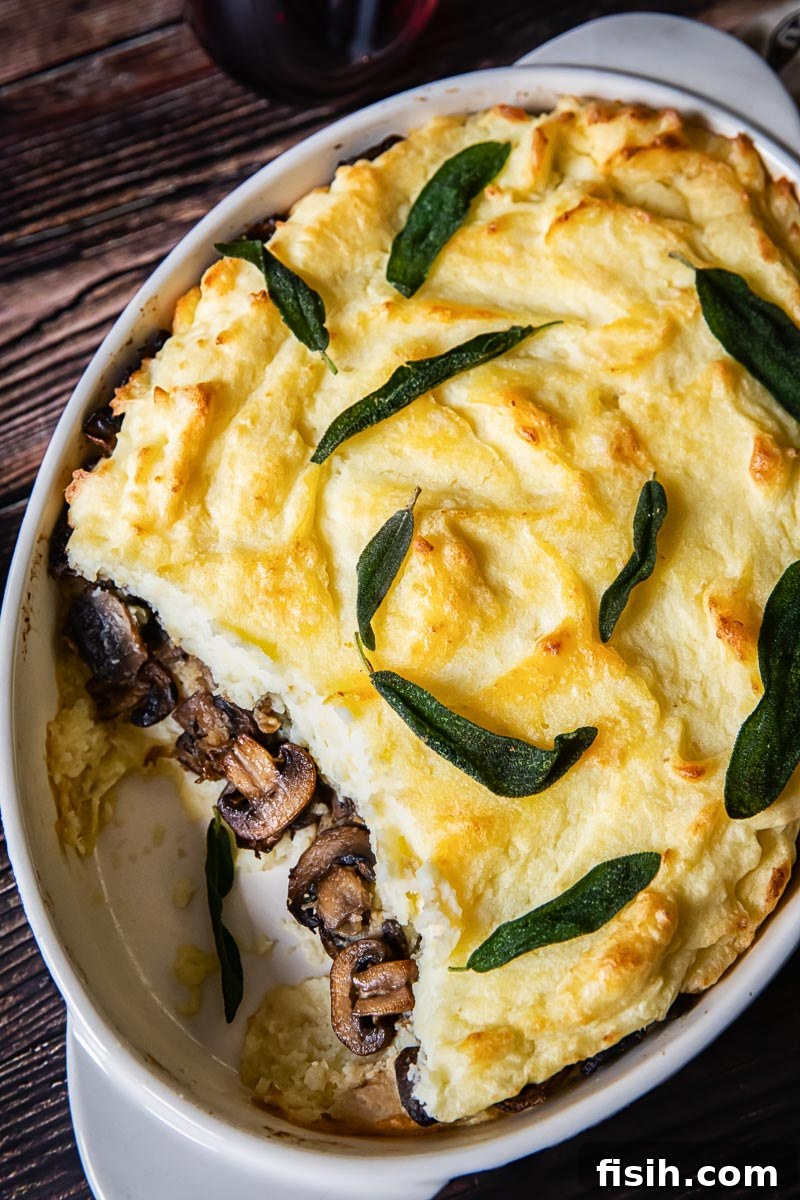 Creamy Potato Bake with Caramelized Onions and Mushrooms 3 Mashed Potato Casserole revealing a middle layer of mushrooms and caramelized onions