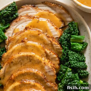 sliced pork loin roast covered with gravy