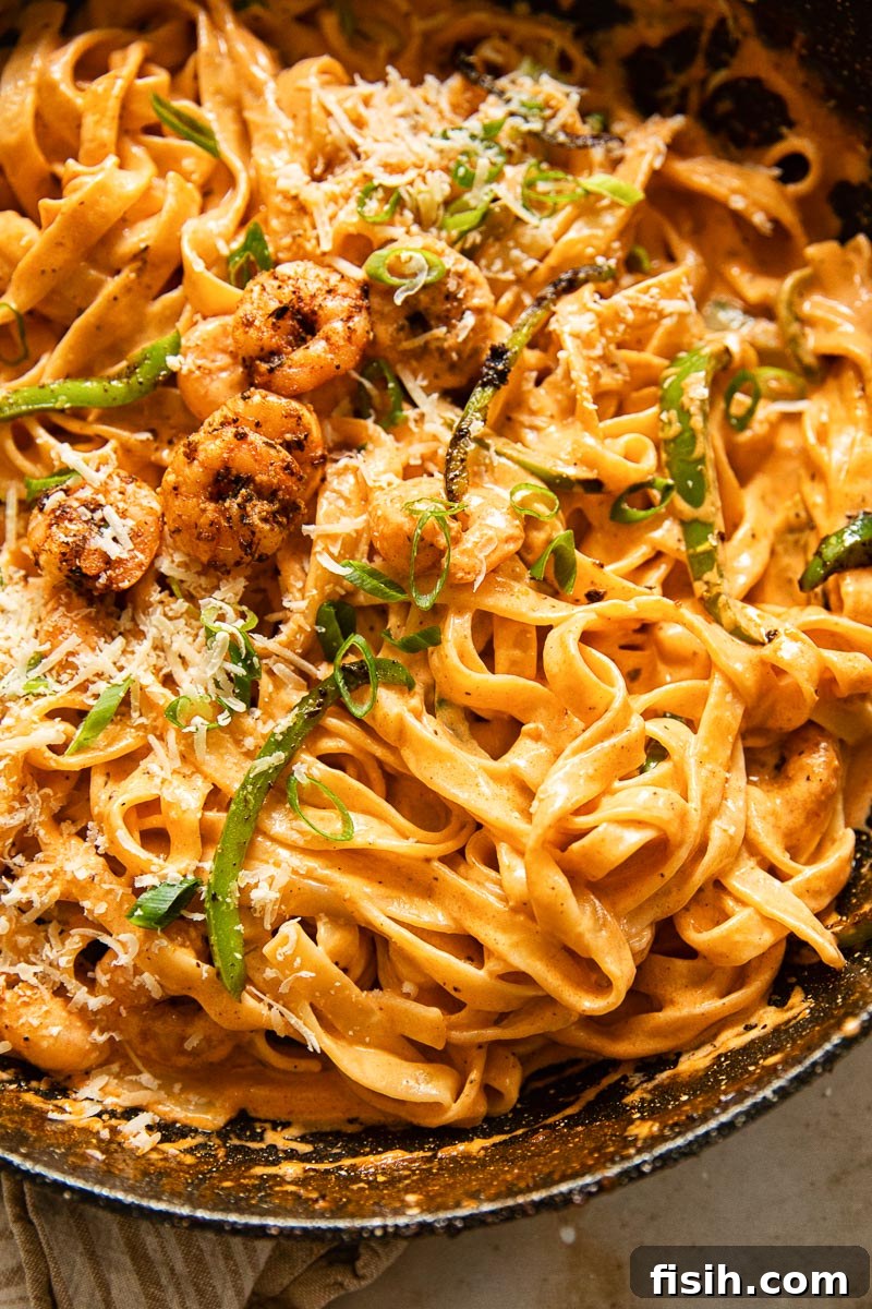 Bayou Blast Shrimp Pasta 2 Vibrant Cajun shrimp pasta garnished with fresh green onions