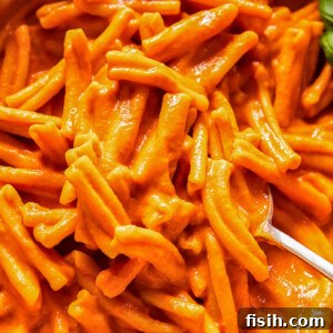 A delectable bowl of pasta covered in rich vodka sauce, ready to be served.