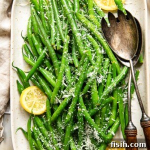 Bright Lemon-Garlic Parmesan Green Beans 6 top down view of green beans with lemon slices and Parmesan