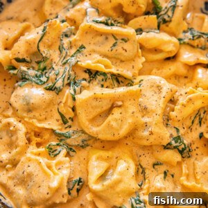 tortellini in creamy sauce in cast iron pan