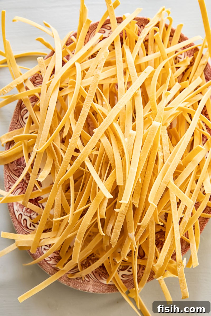 Grandma's Comforting Chicken Noodle 4 a pile of homemade noodles on a platter