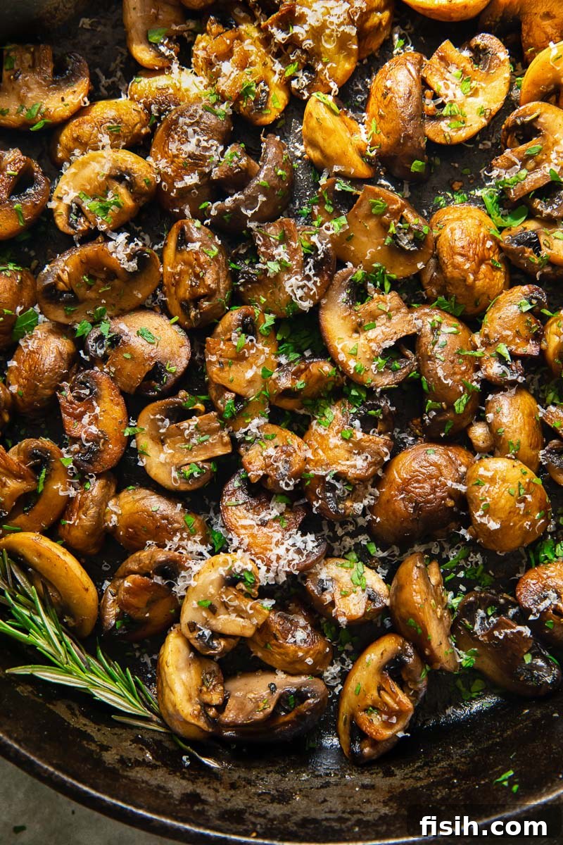 Sautéed Garlic Parmesan Mushrooms 2 Golden pan-fried garlic mushrooms sprinkled with fresh Parmesan and fragrant rosemary