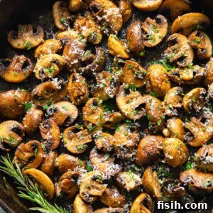 Sautéed Garlic Parmesan Mushrooms 5 cooked mushrooms in a pan