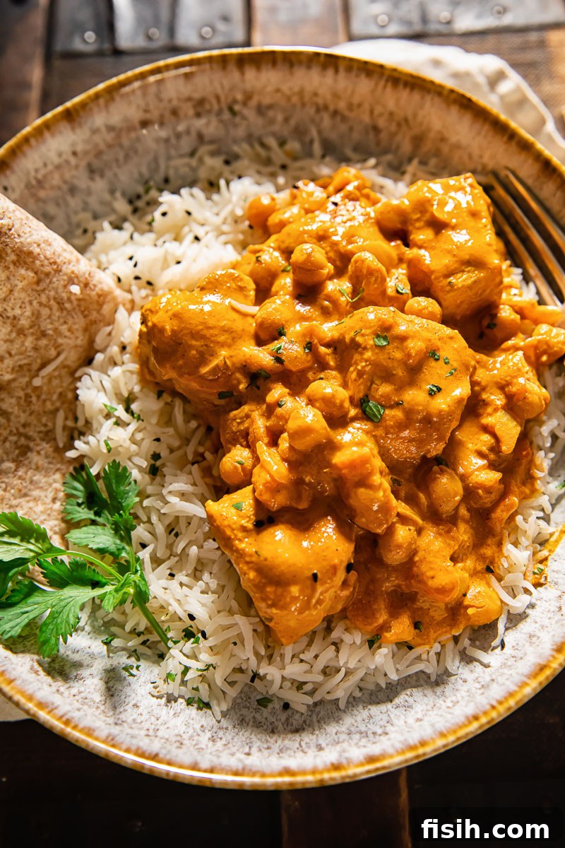 Rich and Creamy Chicken Tikka Masala 3 A vibrant bowl of homemade Chicken Tikka Masala served over fluffy basmati rice, ready for a comforting meal.