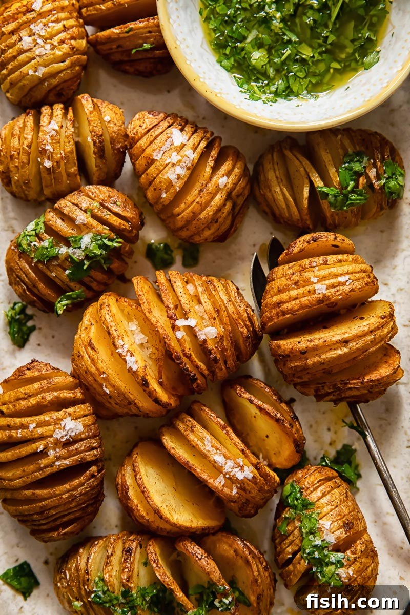 top down view of hasselback potatoes with herb dip