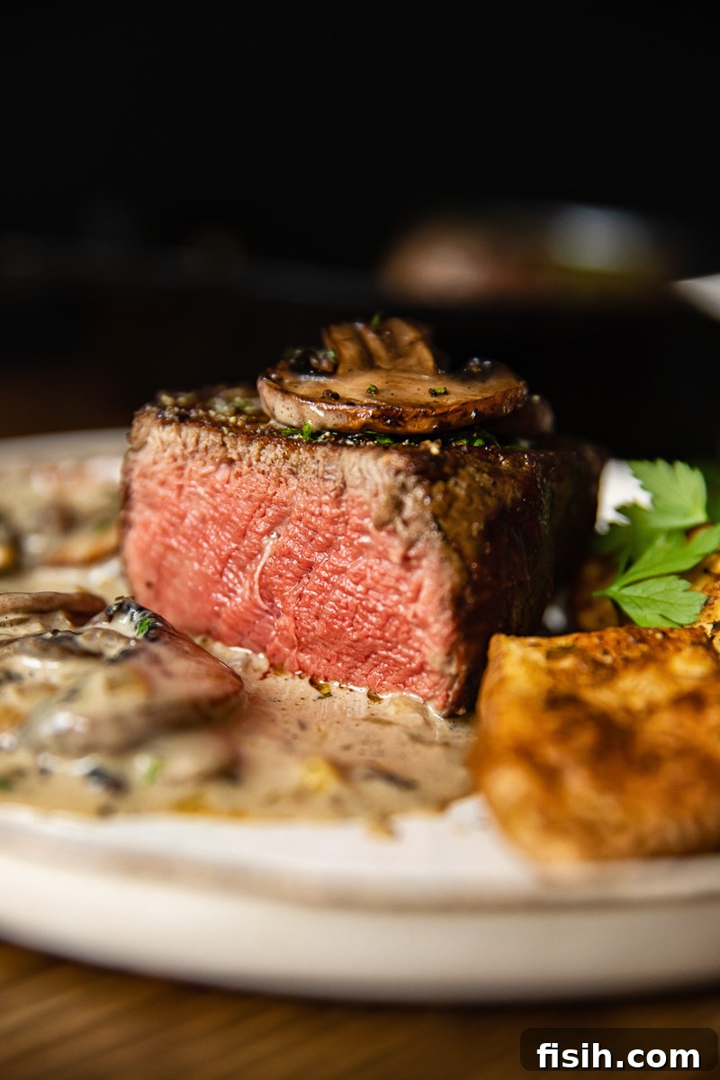 Perfectly cooked filet mignon, sliced to show its tender, pink interior and a beautiful sear