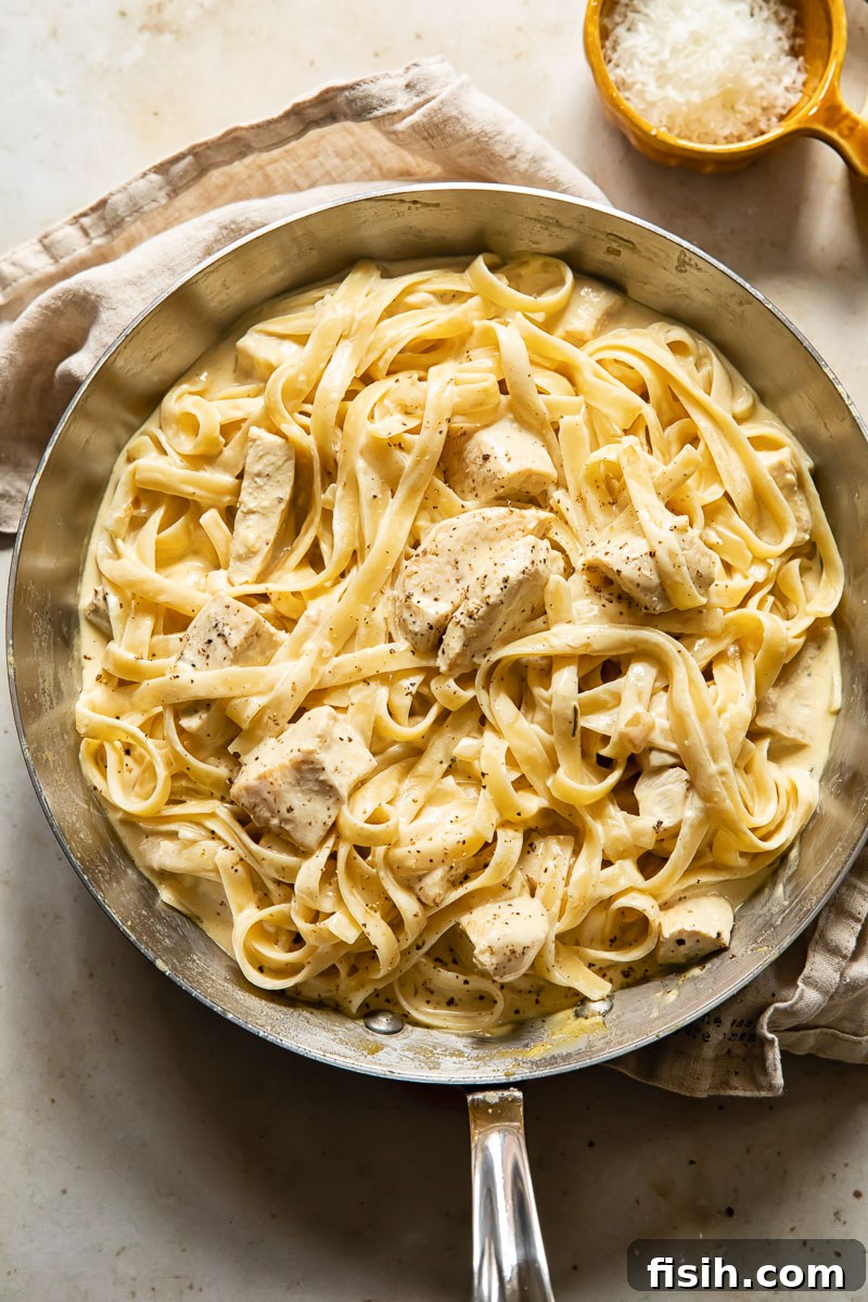 top down view of creamy chicken pasta in a pan