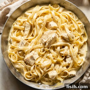 top down view of creamy chicken pasta in a pan