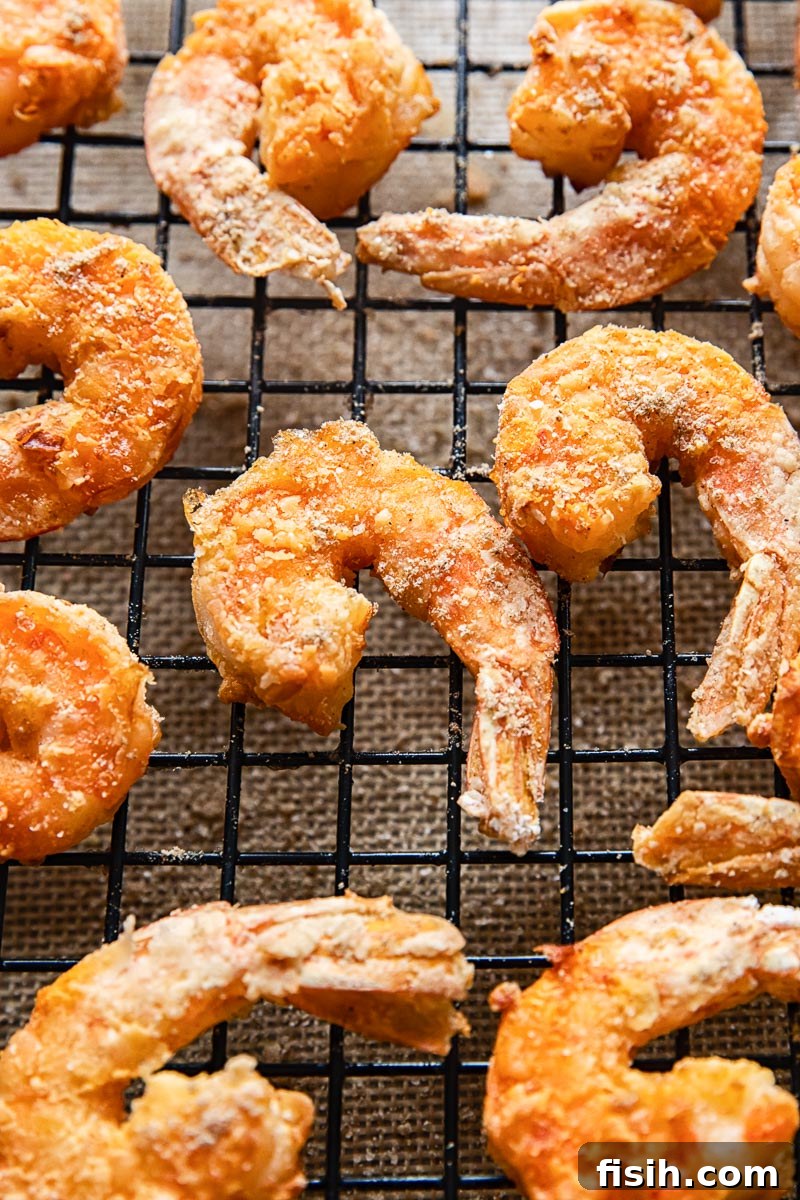 Crispy Air Fryer Salt and Pepper Shrimp 4 Close-up of perfectly air-fried salt and pepper shrimp, showcasing its golden crispy coating and tender texture