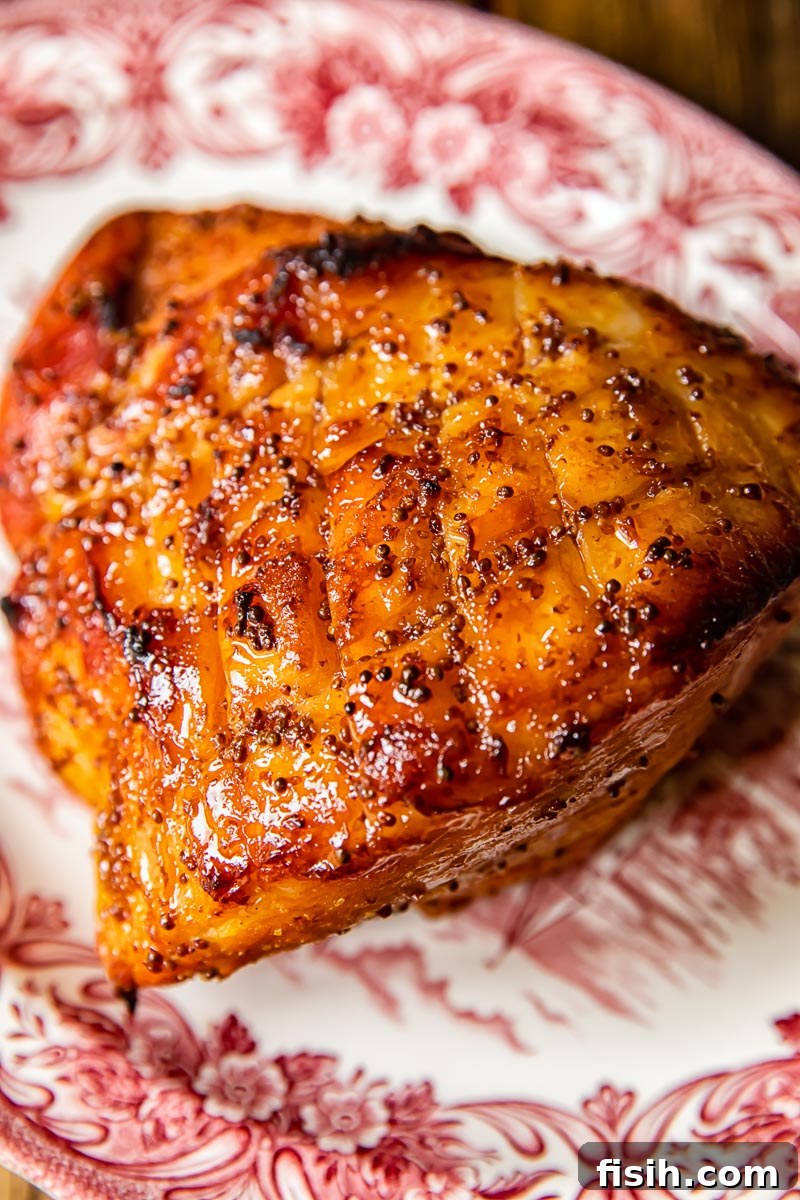 top down view of beautifully glazed ham, sliced and ready to serve