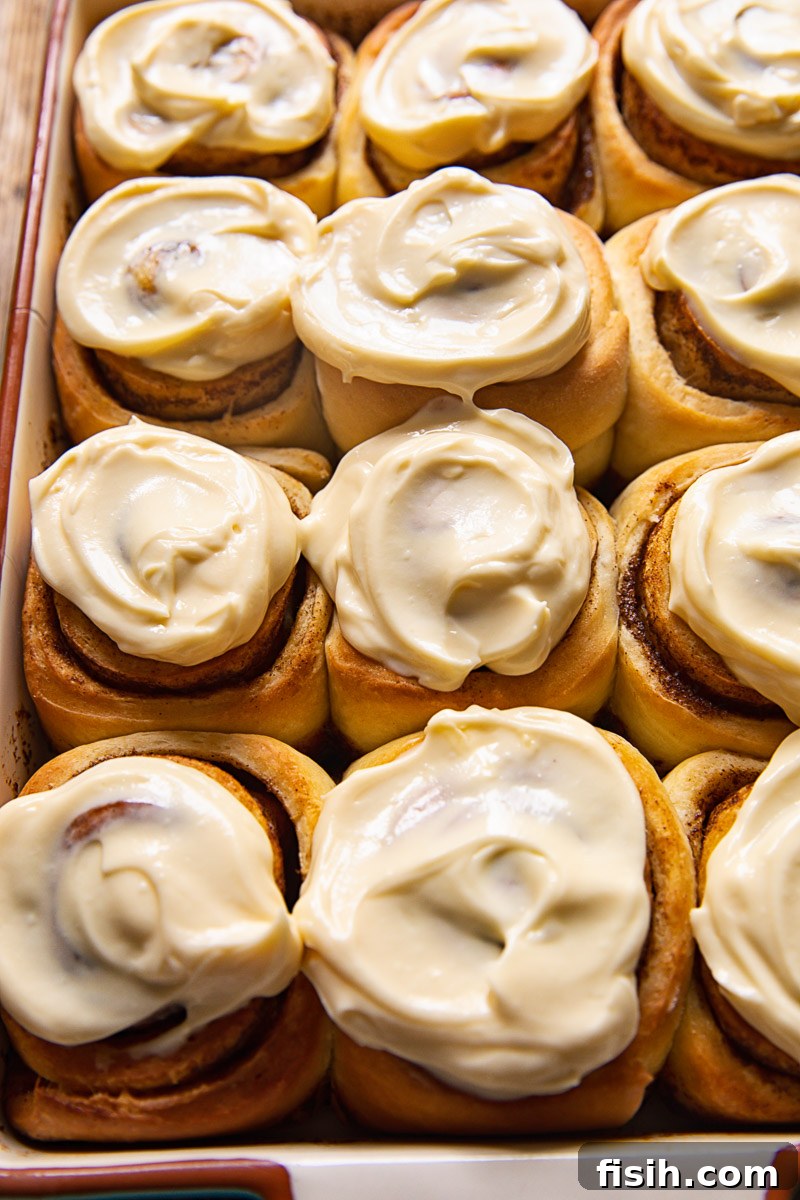 cinnamon rolls with icing in a pan