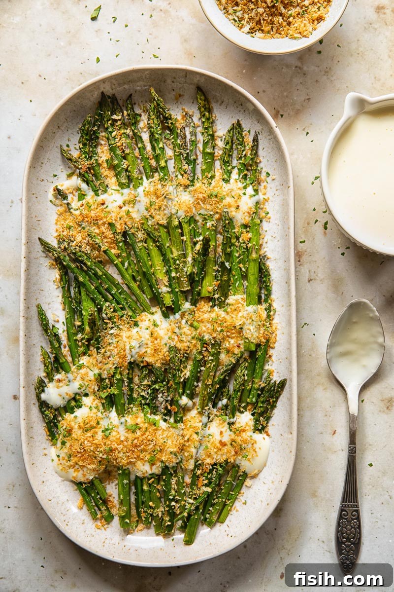 Mornay Asparagus Bake with Toasted Crumbs 6 top down view of roasted asparagus with cheese sauce and breadcrumbs