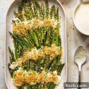 Mornay Asparagus Bake with Toasted Crumbs 7 top down view of roasted asparagus with cheese sauce and breadcrumbs