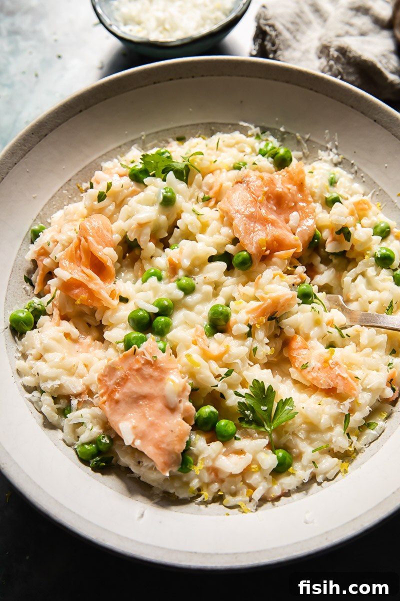 smoked salmon risotto with peas in a bowl