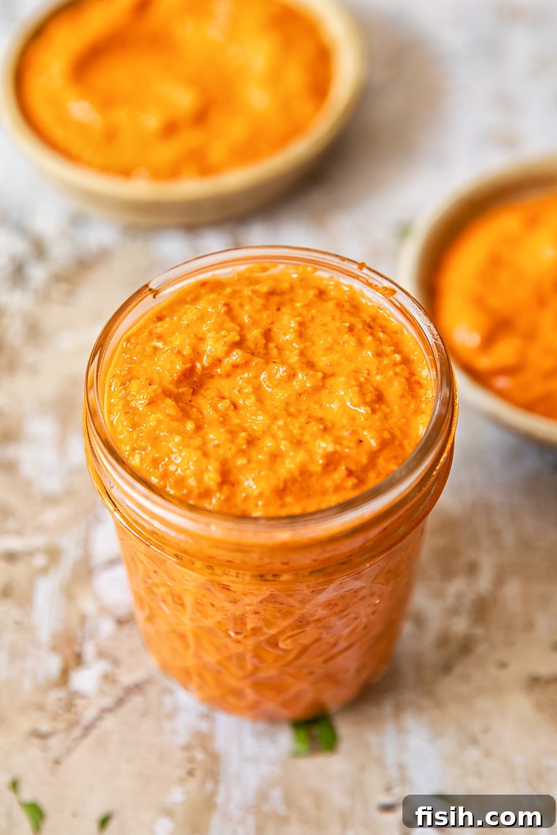 top down view of romesco sauce in a glass jar