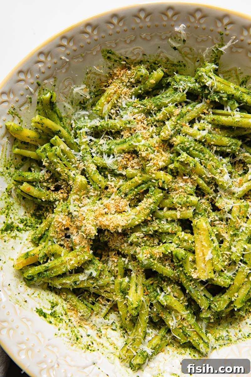 top down view of kale pesto pasta with breadcrumbs