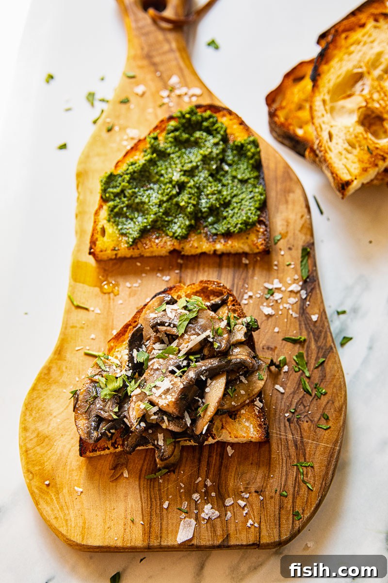 Forest Mushroom Toasts 4 top down view of crostini on wooden board