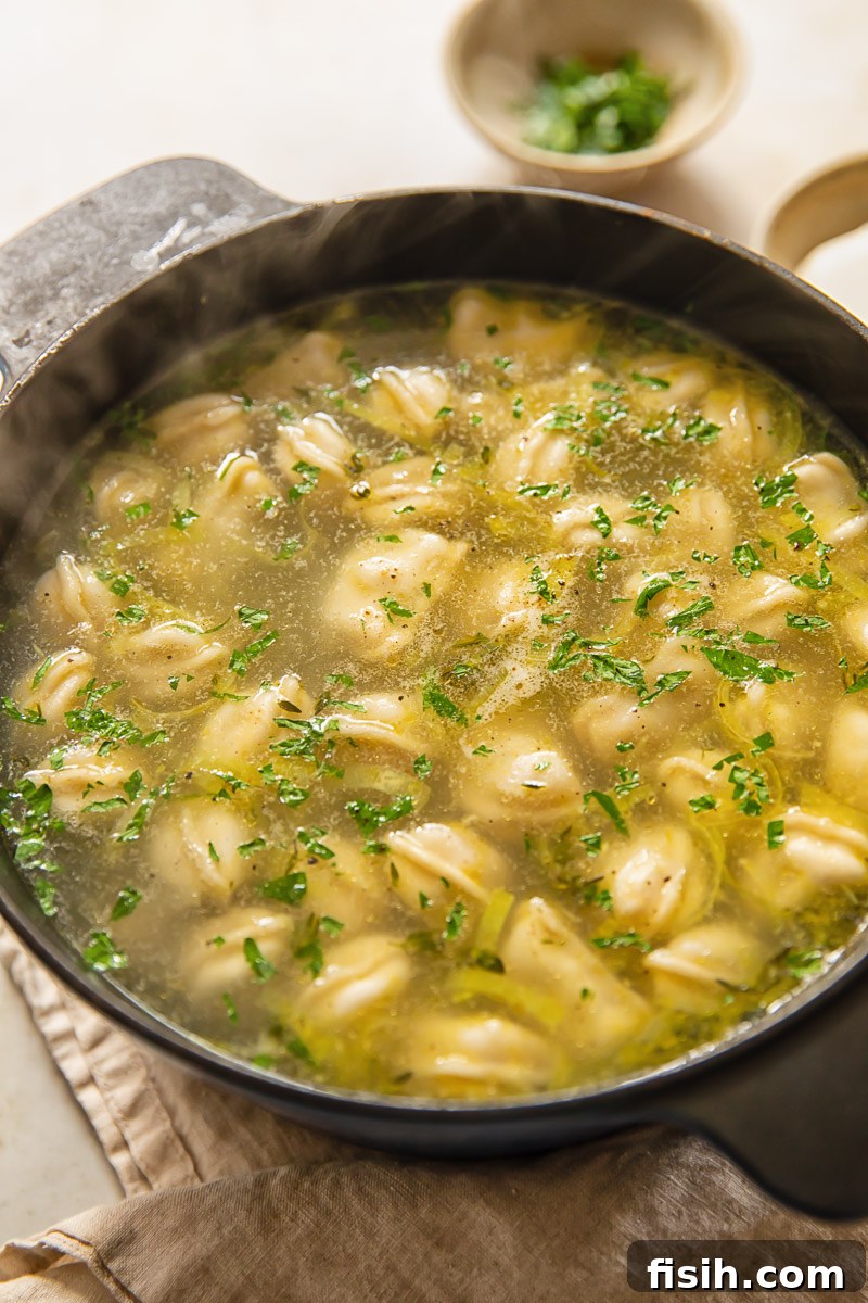 a pot of soup with dumplings in a pot
