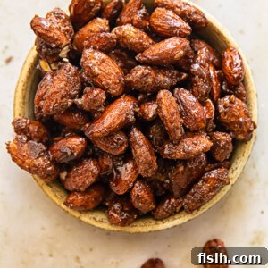 Close up of serving dish of candied almonds, representing the final delicious product.