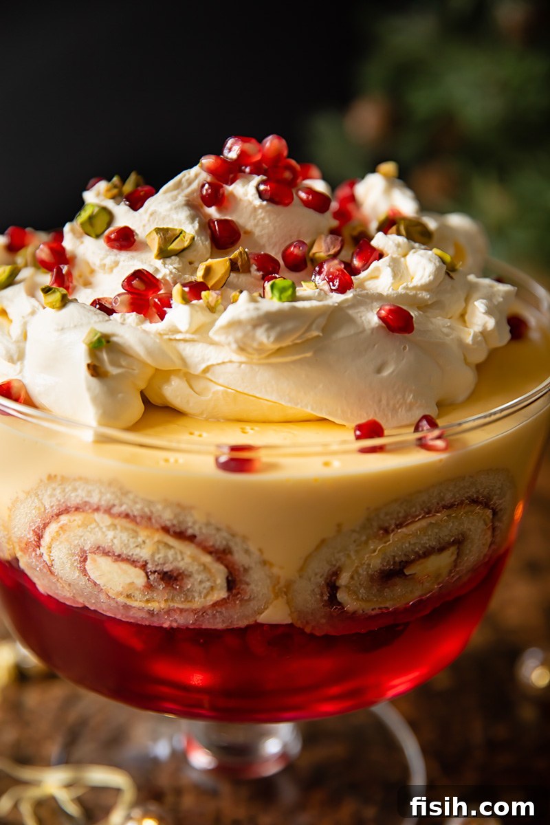 Close-up view of a berry trifle showing its beautiful layers and fresh fruit