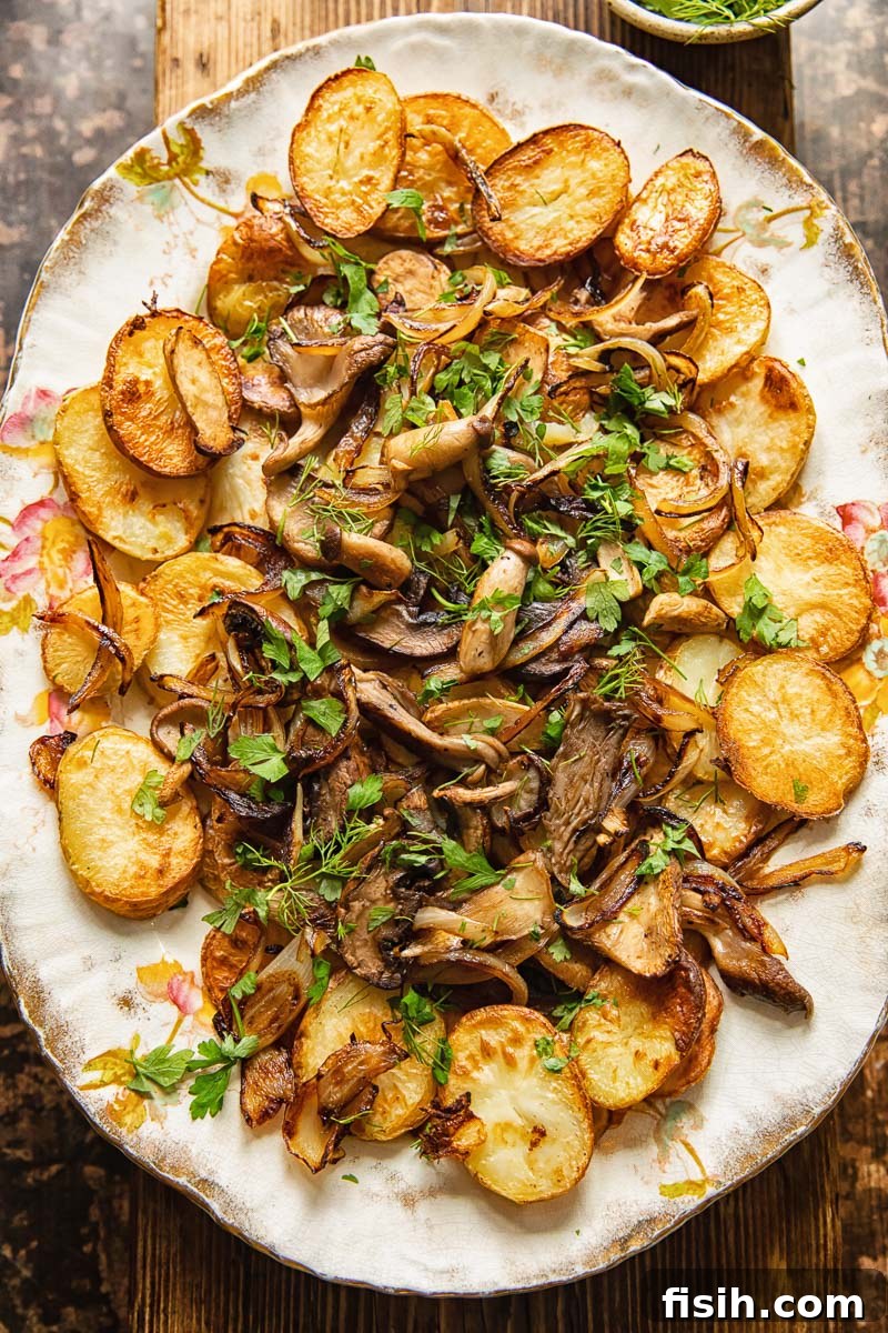 Crispy Oven Potatoes with Mushrooms and Onions 2 top down view of fried potatoes and mushrooms topped with herbs