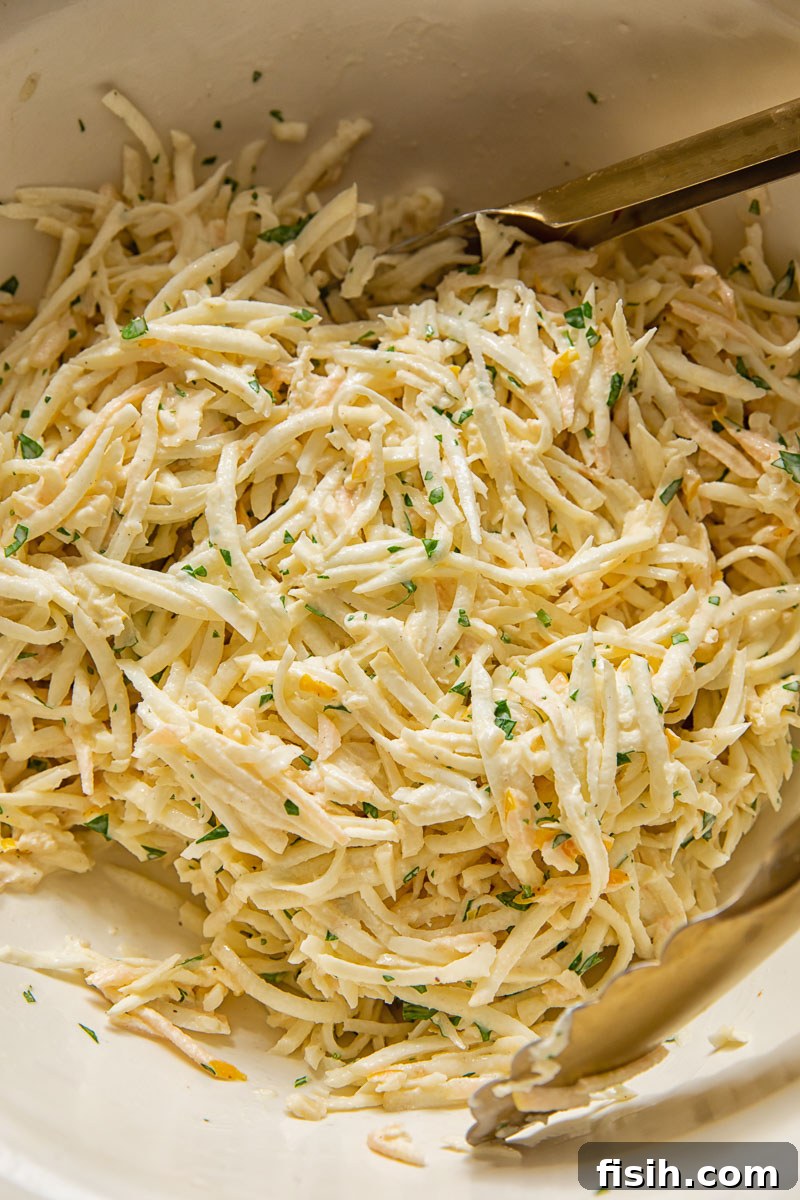 close up of grated celeriac slaw in a bowl
