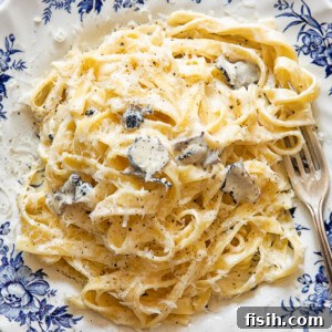 Creamy Truffle Tagliatelle 7 Top down view of tagliatelle pasta with truffle sauce on a plate