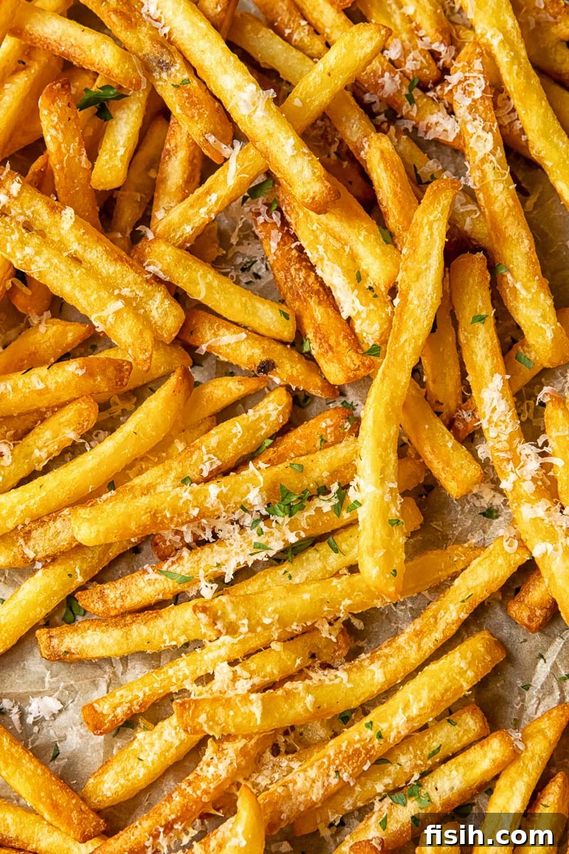 Close up shot of parmesan truffle fries on a tray