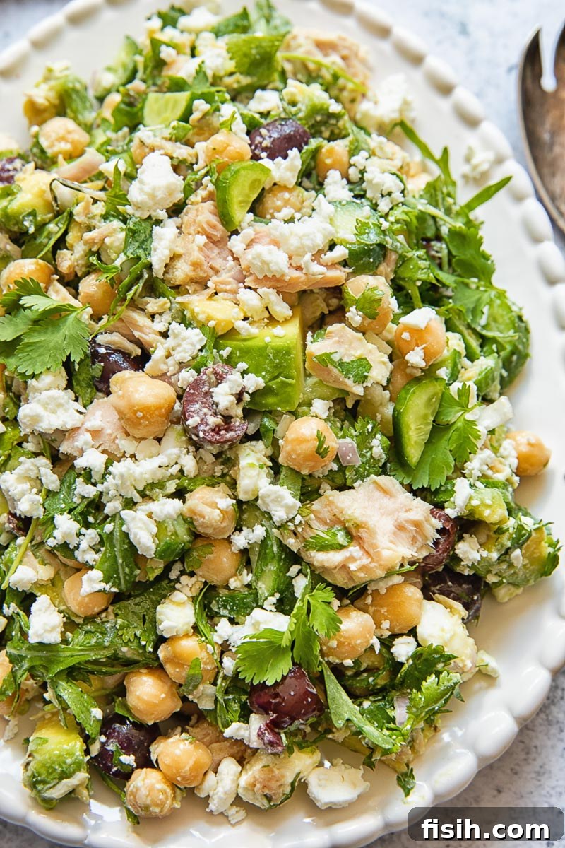 Close up of chickpea tuna salad with avocado and feta on a platter