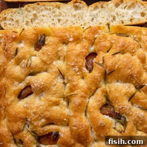 Effortless Artisan Focaccia 6 focaccia bread with a few slices cut
