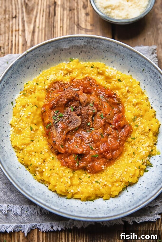 Liquid Gold Saffron Risotto 5 bowl of risotto with a red tomato and mushroom topping