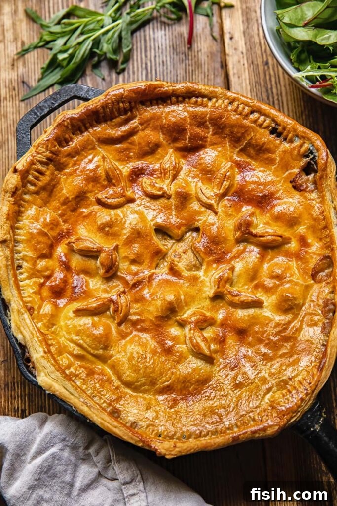 Savory Woodland Bake 3 Top down view of a baked chicken and mushroom pie