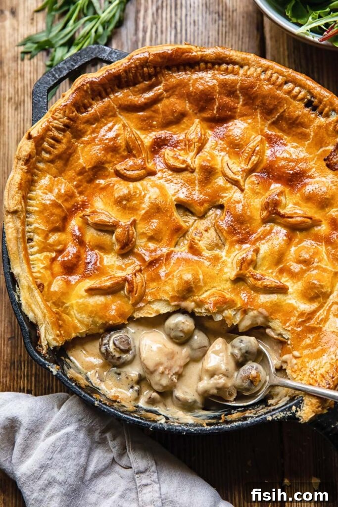 Savory Woodland Bake 5 Chicken and mushroom pie with slice removed and creamy insides showing