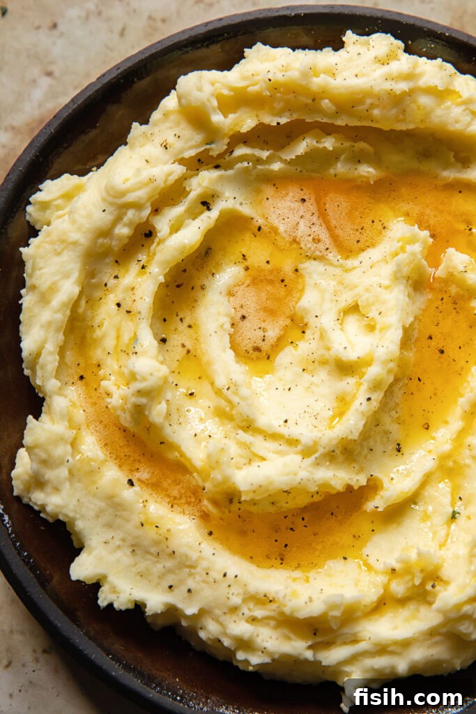 Close up of mashed potatoes with brown butter on top