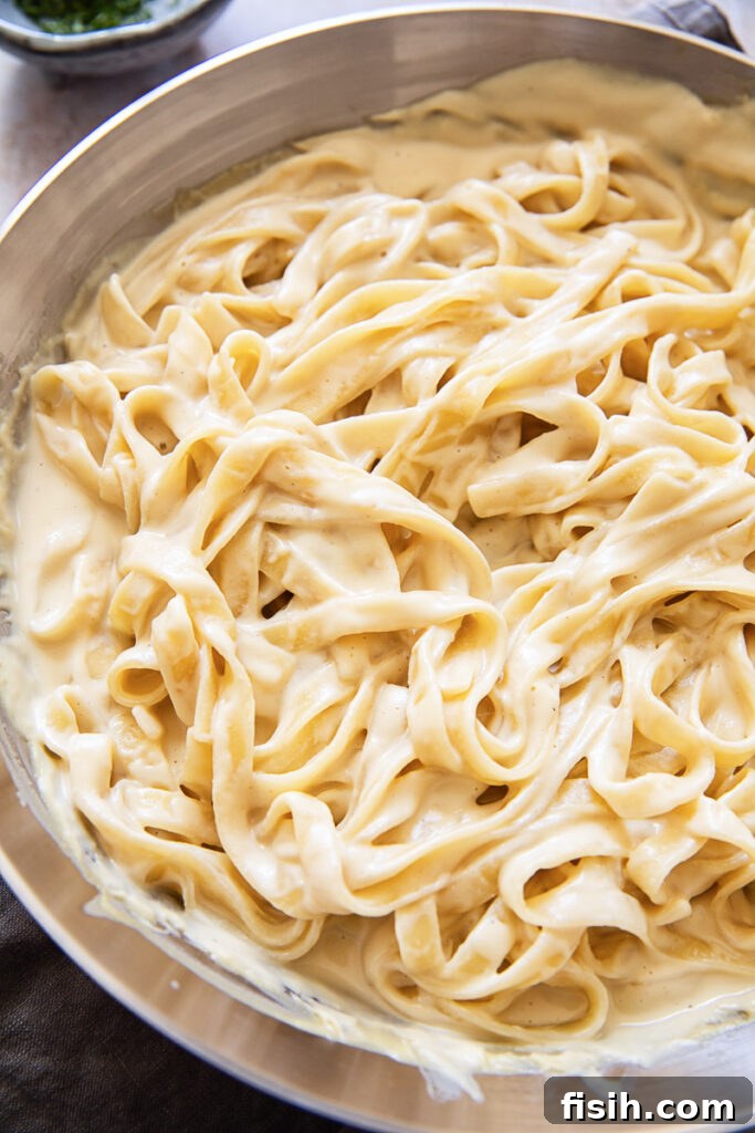 Creamy Vegan Alfredo Sauce 3 A bowl of tagliatelle in a creamy cashew Alfredo sauce