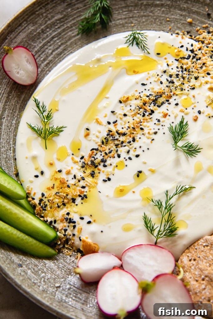 Close up of whipped feta dip with vegetables on a plate