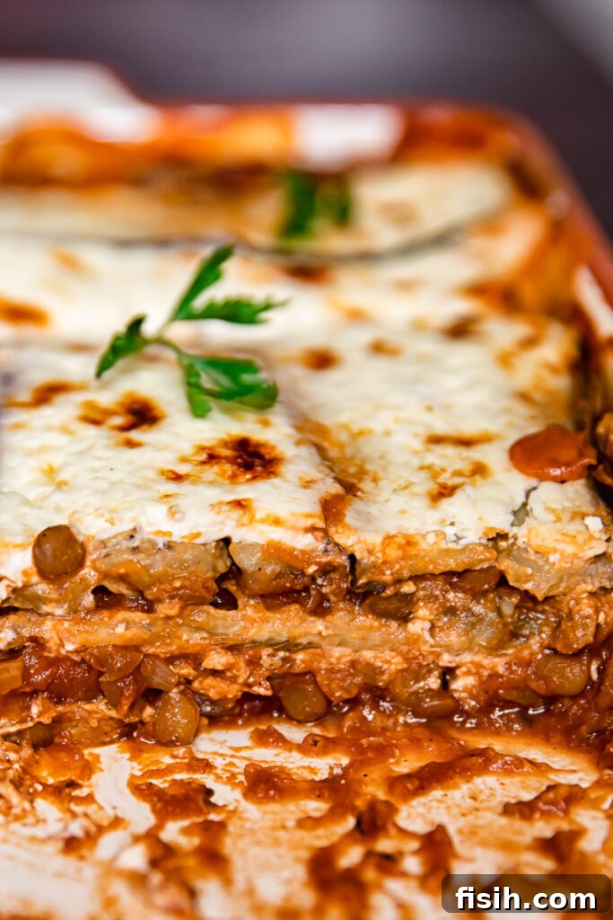 Wholesome Plant-Based Lentil Moussaka 3 Side view of moussaka in a baking dish
