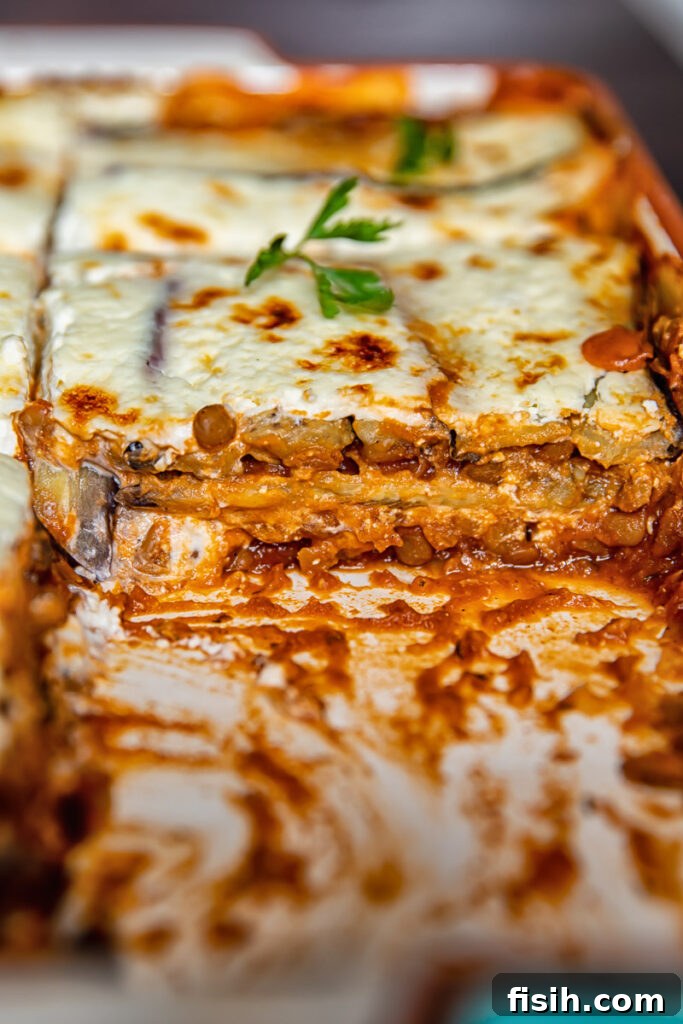 Wholesome Plant-Based Lentil Moussaka 6 Close up side view showing the cross section of a slice