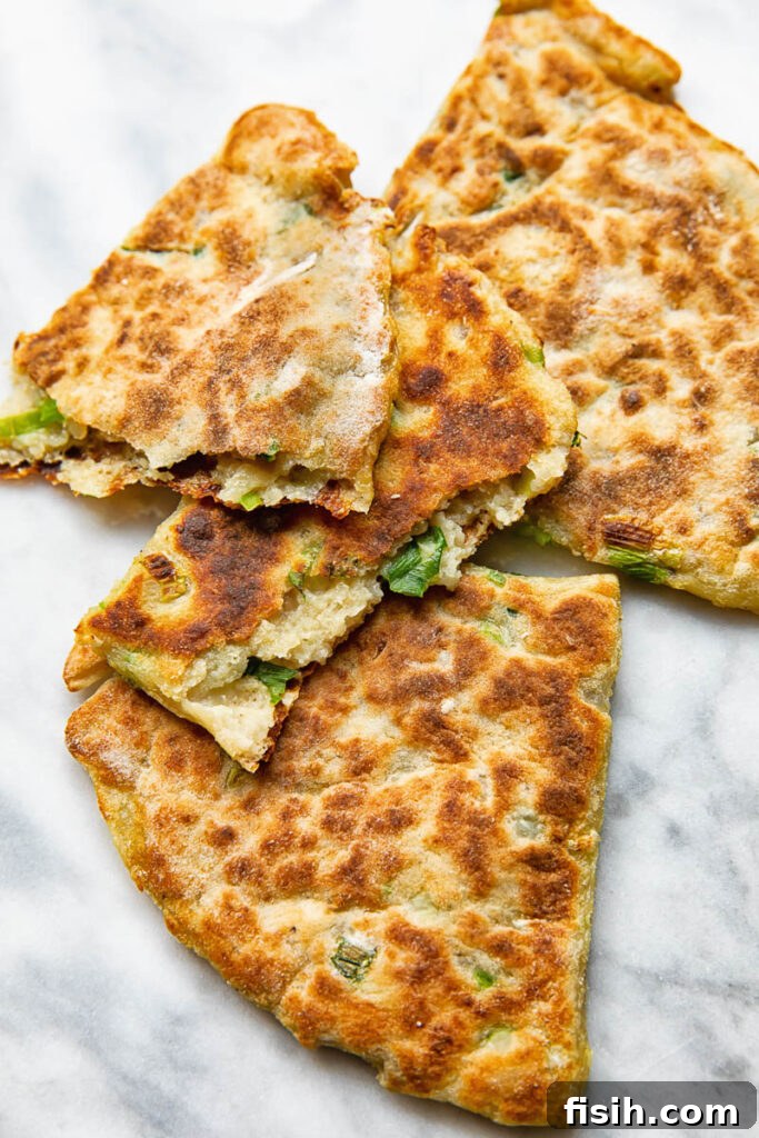 Close up shot of cut open pieces of irish potato farls stack on top each other