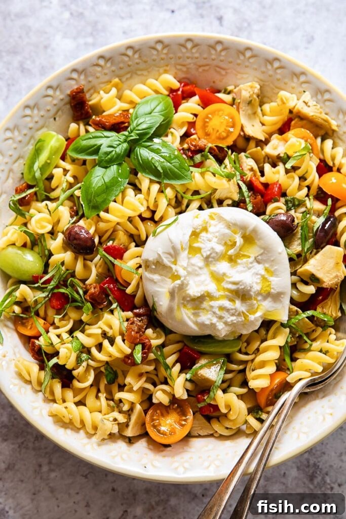 Pasta salad in a bowl with a spoon
