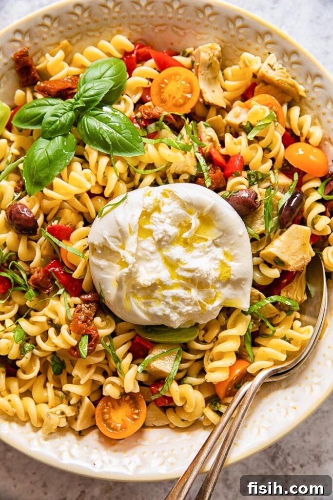 Top down of a bowl of pasta salad with burrata