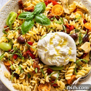Pasta salad in a bowl with a spoon