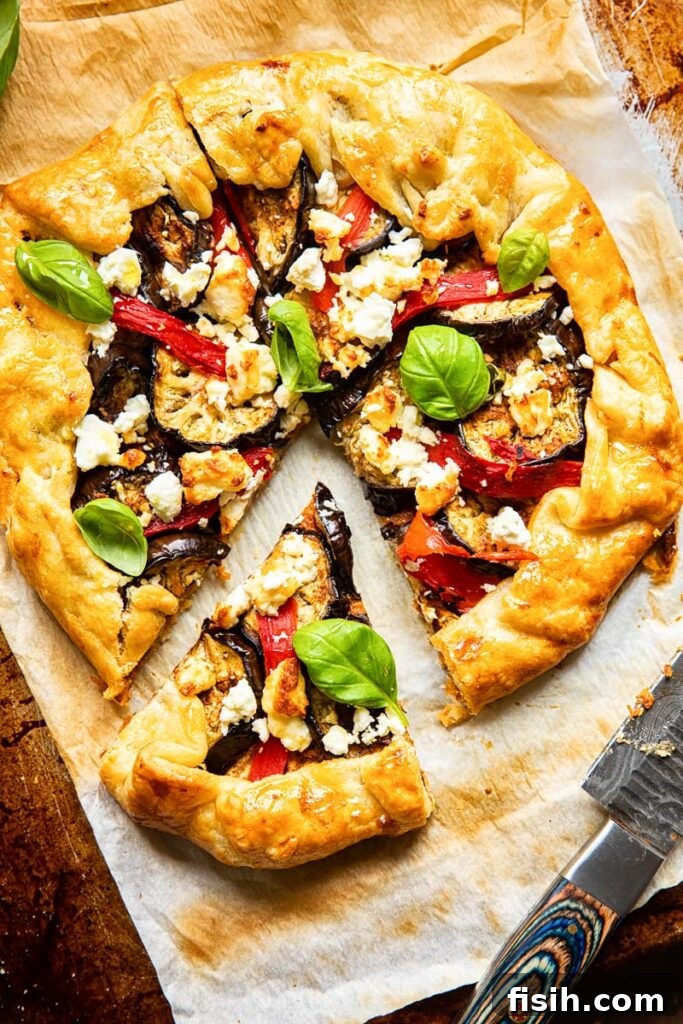 Top down view of galette cut into slices, showcasing the vibrant filling and golden crust.
