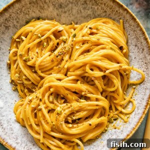 Bowl of roasted butternut squash pasta with pistachio crumb